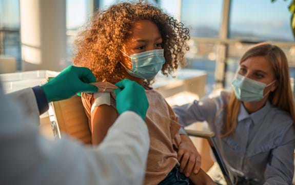 child receiving vaccine