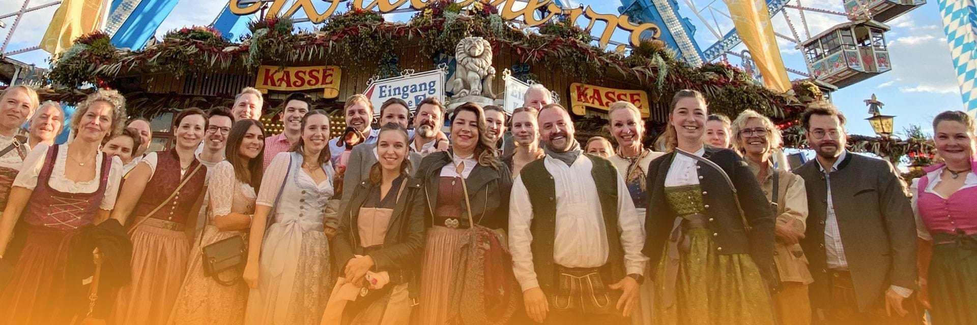 Large group in front of a ferris wheel