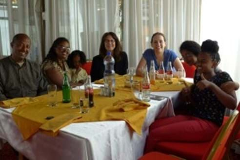 Group of adults gathered at table