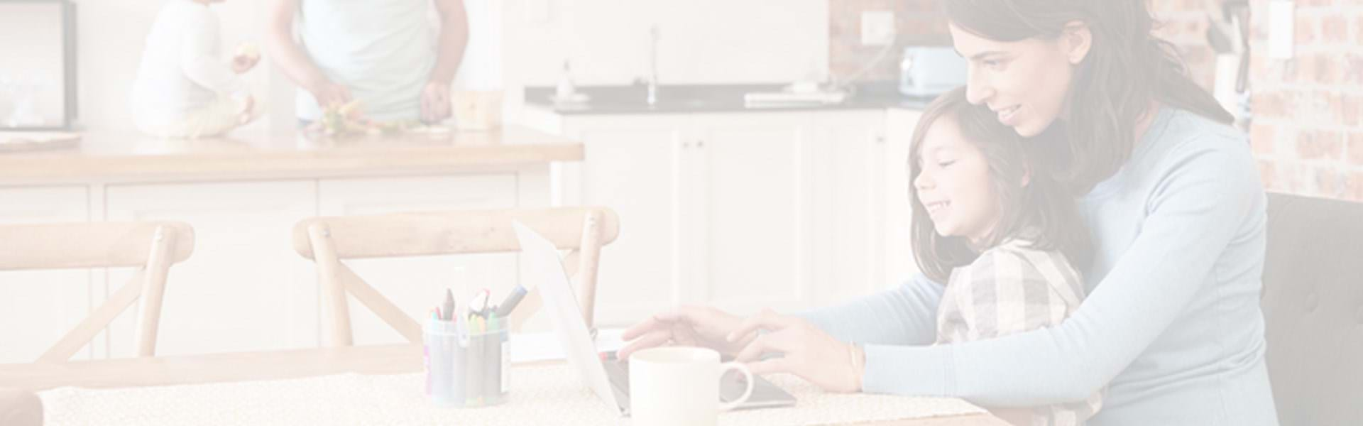 Consumers interacting with laptop at home