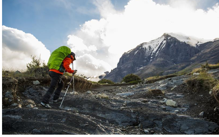 Man hiking up mountain - Six lessons from Patagonia on Brand Purpose