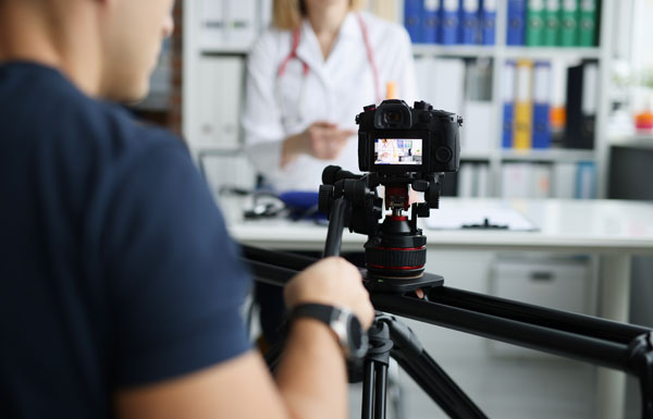 man filming medical video