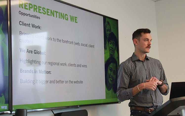 Employee interacting with projector screen