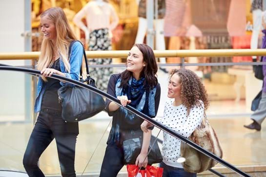 Three women shopping in mall