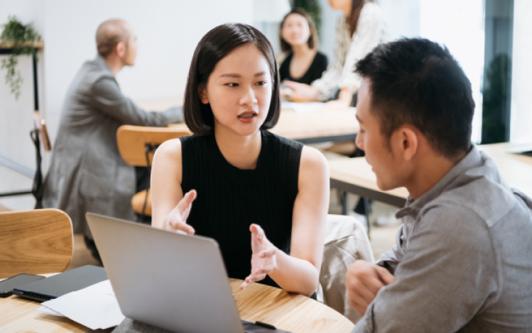 Two employees in deep discussion