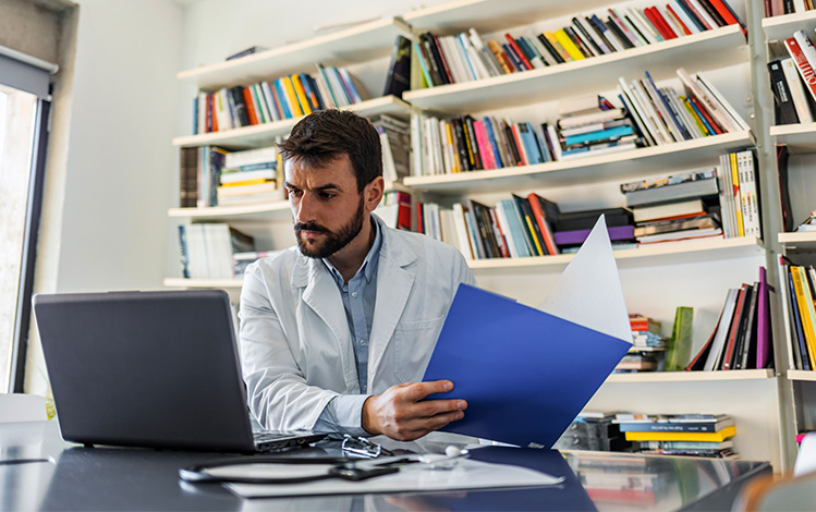 doctor looking at files